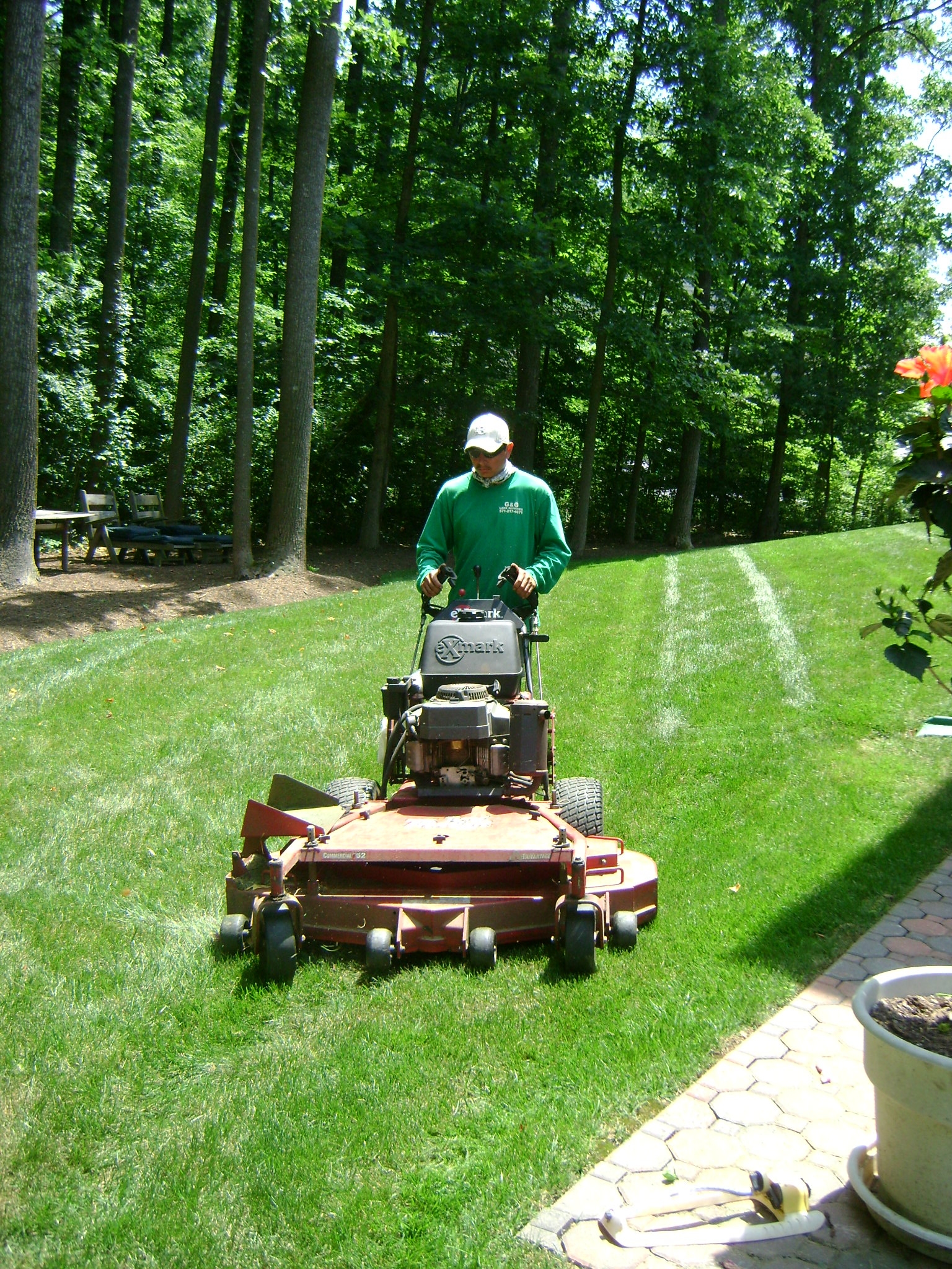Technician using professional lawn mower
